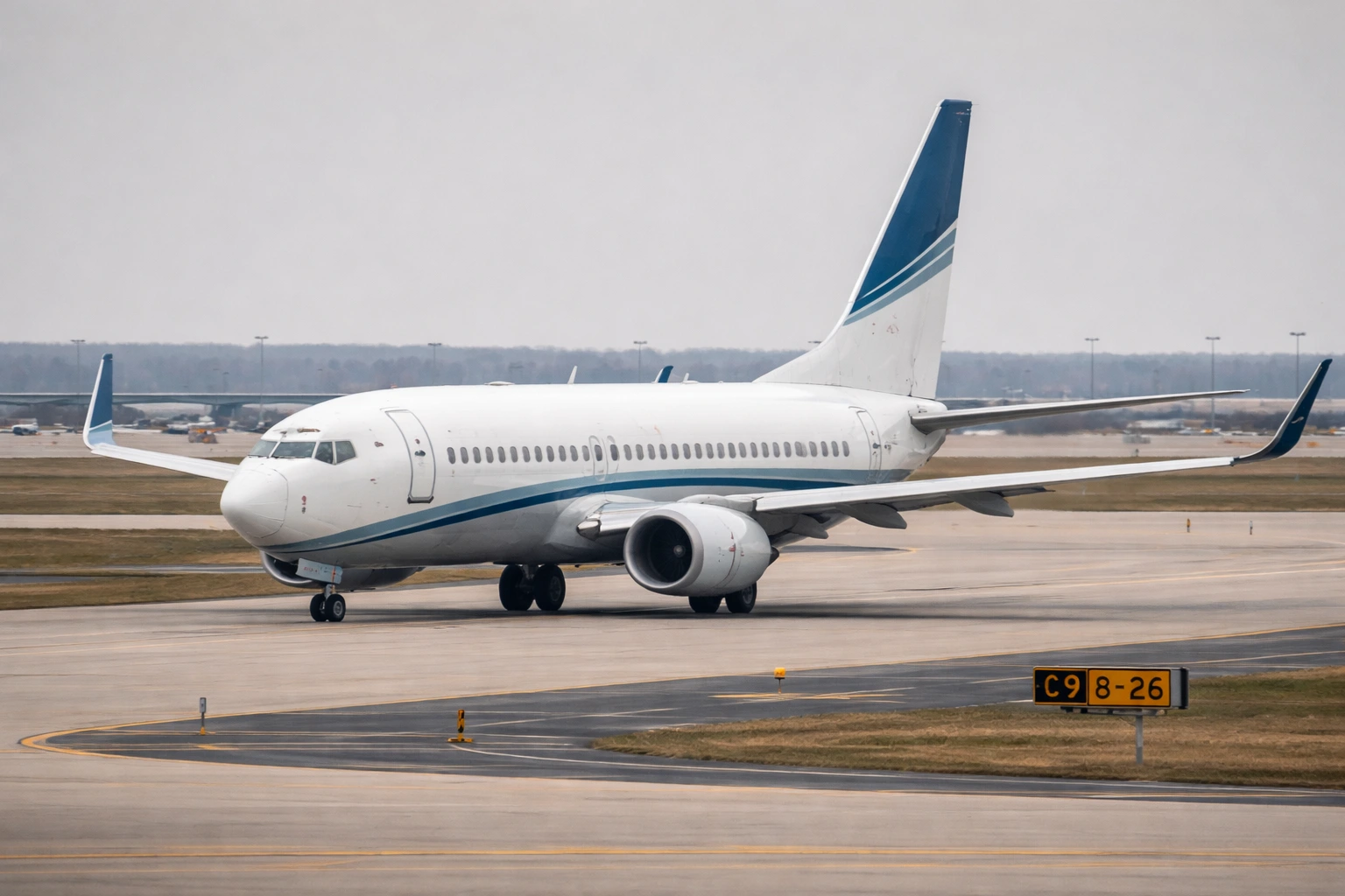 Boeing 737-700 passenger aircraft taxiing at a major airport