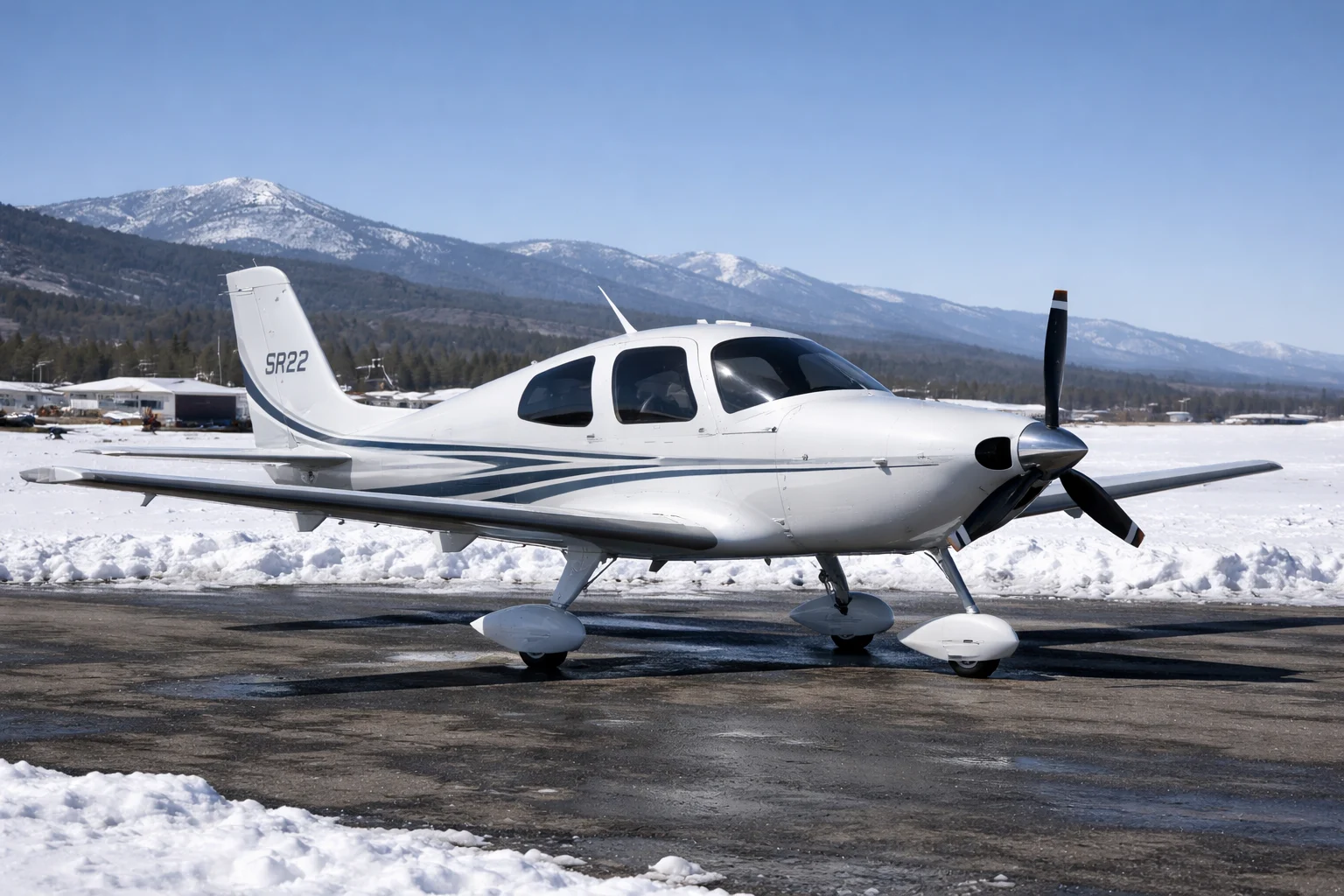 Cirrus SR22 single-engine aircraft on an airport ramp in winter daylight