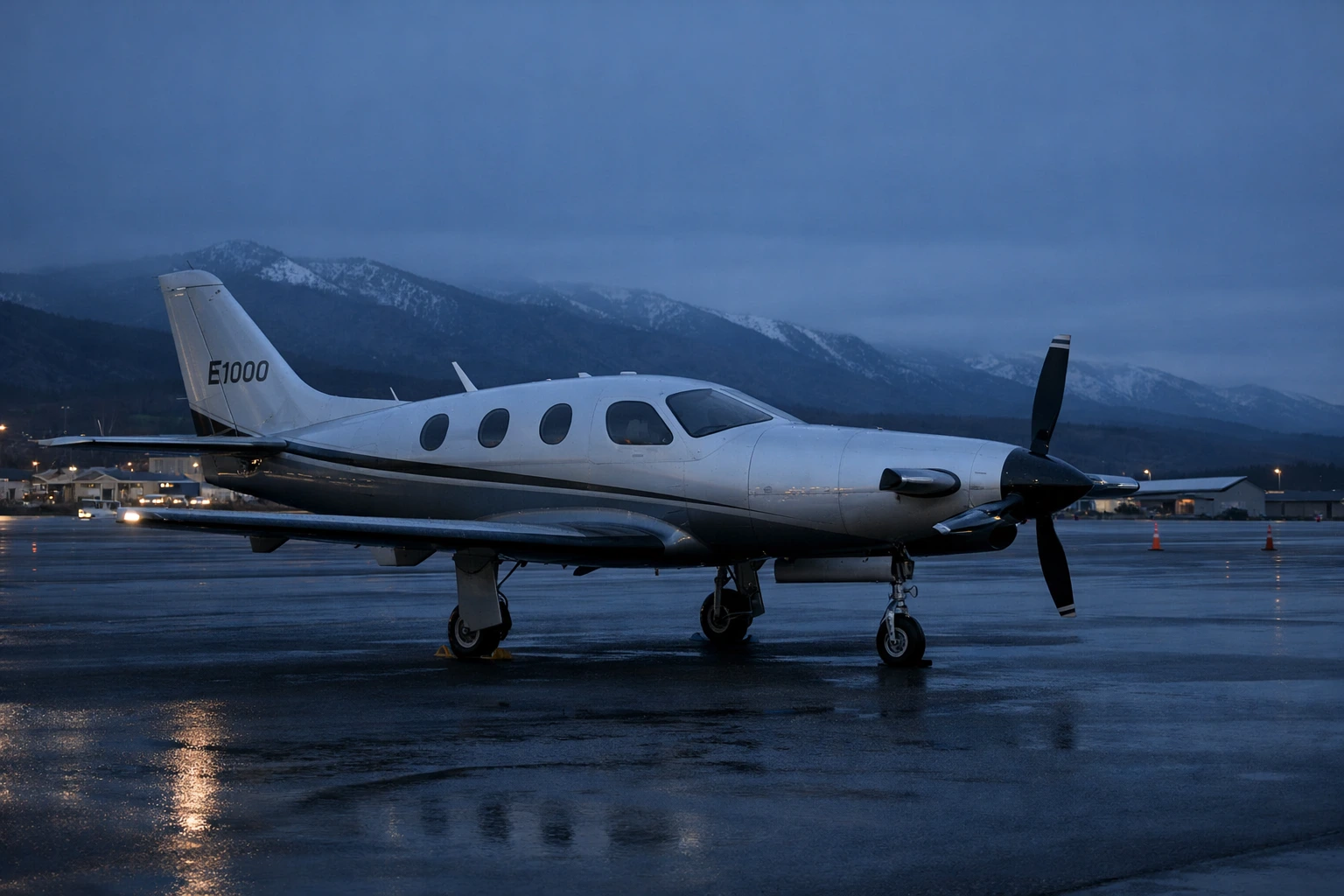 Epic E1000 turboprop aircraft on an airport ramp at a mountain regional airport