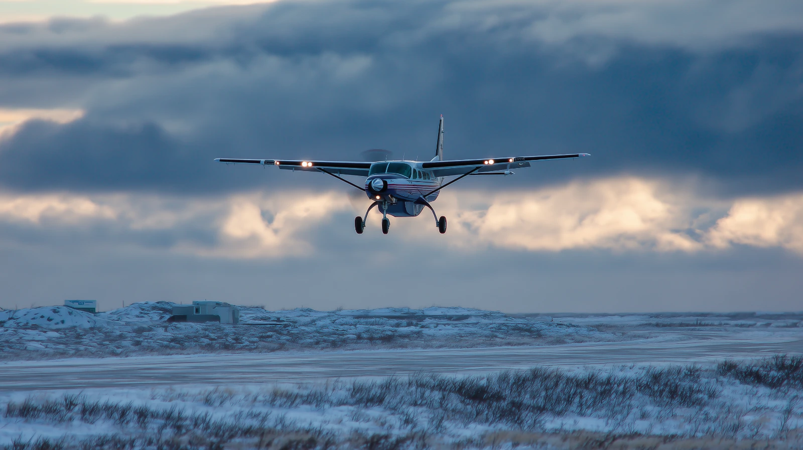 Bering Air Cessna 208B Grand Caravan flying near Nome Alaska in winter conditions